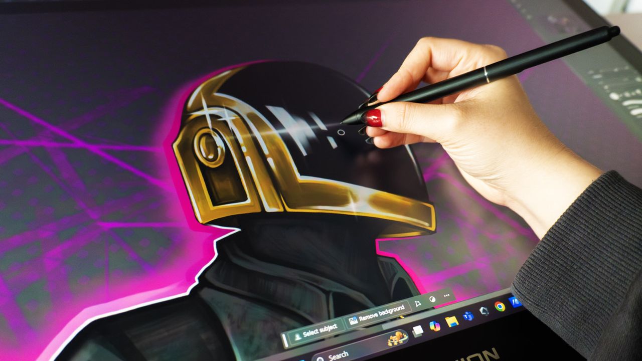 A Huion Kamvas Pro 27 drawing tablet in use on a desk