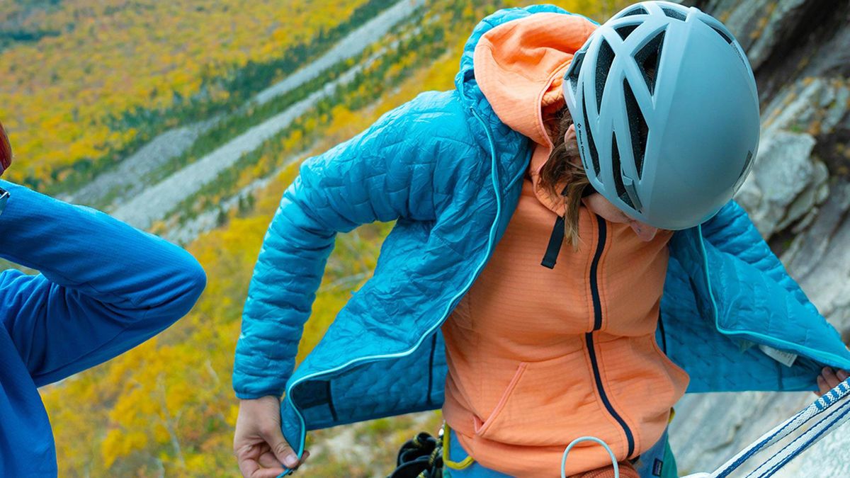 Patagonia Nano Puff Jacket worn by a climber on the side on a mountain.