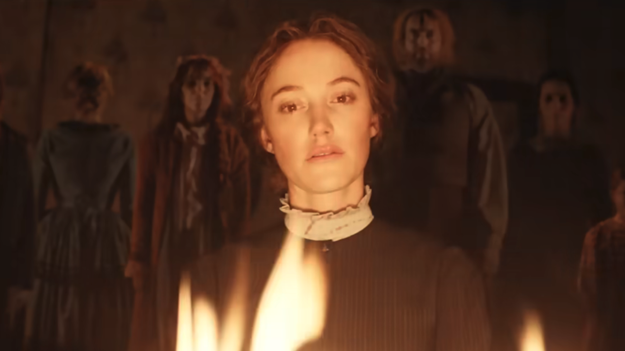 Maika Monroe looking into a fire in Victorian Psycho