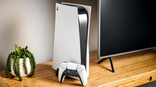 Sony PS5 on a table next to a TV