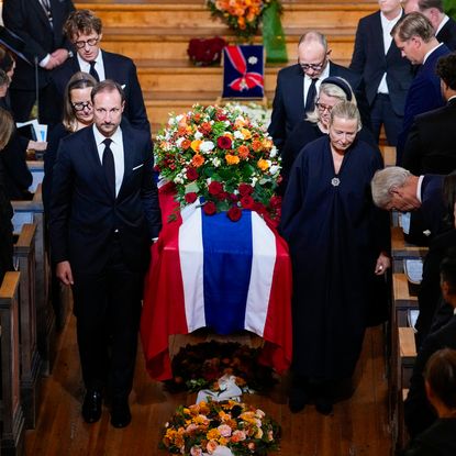 King Haakon and family carrying Princess Astrid's coffin at her funeral