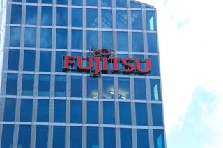 The logo of Japanese multinational information technology equipment and services company Fujitsu is seen on a skyscraper in Munich