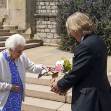 windsor, england june 09 no sales queen elizabeth ii receives a duke of edinburgh rose, given to her by keith weed, president of the royal horticultural society, at windsor castle on june 9, 2021 in windsor, england a royalty from the sale of each rose will go to the duke of edinburghs award living legacy fund which will give more young people the opportunity to take part in the duke of edinburgh award photo by steve parsons wpa poolgetty images