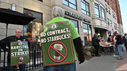 Workers strike outside a Starbucks in Albany, New York, in 2025.