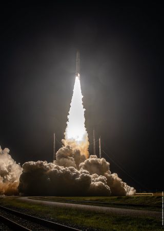 Liftoff of Ariane 5 VA261 into the black night sky at Europe's Spaceport in French Guiana.