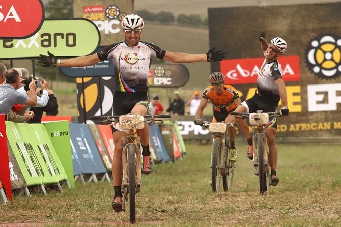 Christoph Sauser and Frantisek Rabon of Meerendal Songo Specialized celebrate after winning Stage 3