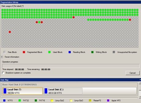 A screenshot image of Total Defrag 2010 shows a disk analysis in progress. Notice how the bottom part of the window shows two partitions.