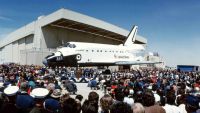 endeavour space shuttle surrounded by hundreds of people.