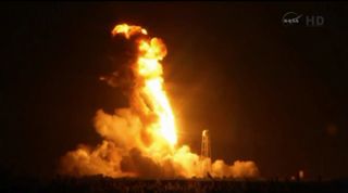 An Orbital Sciences Antares rocket explodes in flames during a failed launch on Oct. 28, 2014 from NASA's Wallops Flight Facility on Wallops Island, Virginia. The rocket was carrying an unmanned Cygnus spacecraft filled with 5,000 lbs. of supplies for the International Space Station.