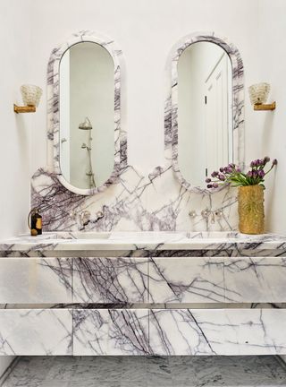 Luxury bathroom with marble vanity and mirror