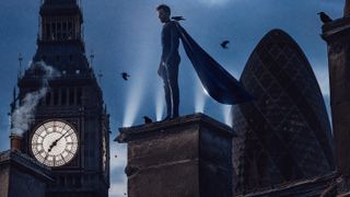 Winged superhero standing on a building overlooking the London skyline