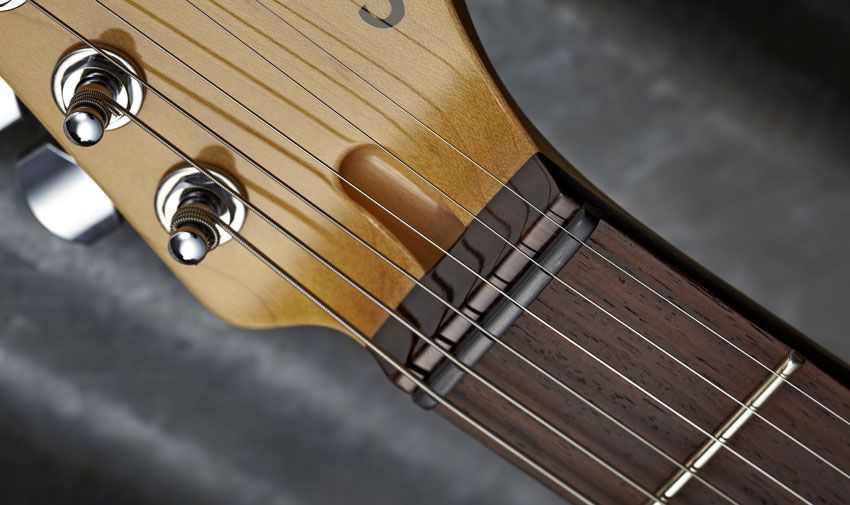 The PT sports a Graph Tech Black Tusq nut and extra jumbo Jescar frets