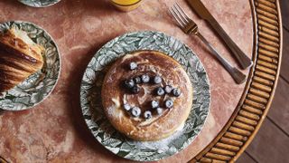 pancake displayed on floral plate on table by soho house retail