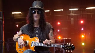 Slash holding Epiphone Slash Les Paul Standard