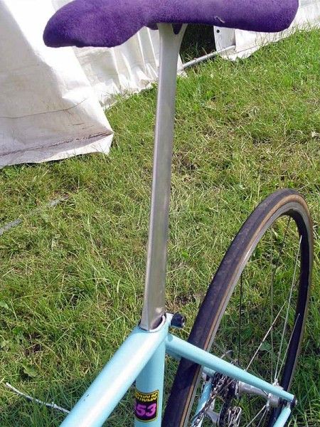 The hand-crafted seatpost is topped by a purple velvety saddle.