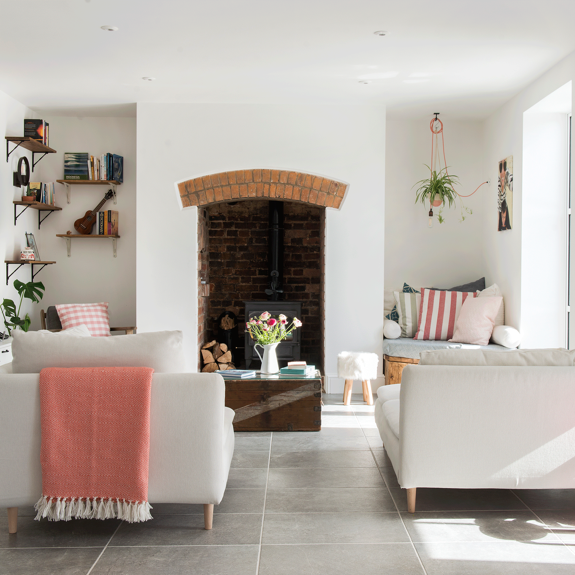 White living room with white sofa and chairs