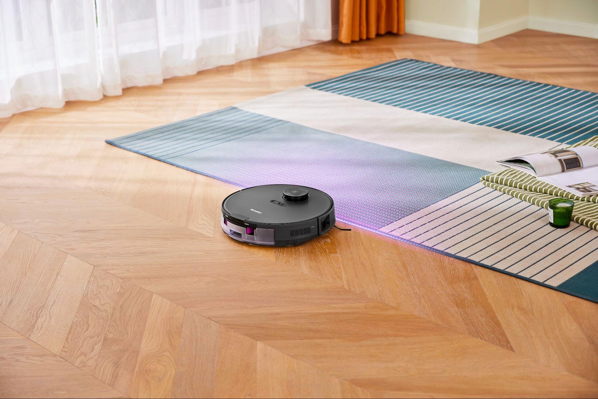 Eureka E20 Plus robot vacuum in action and docked.