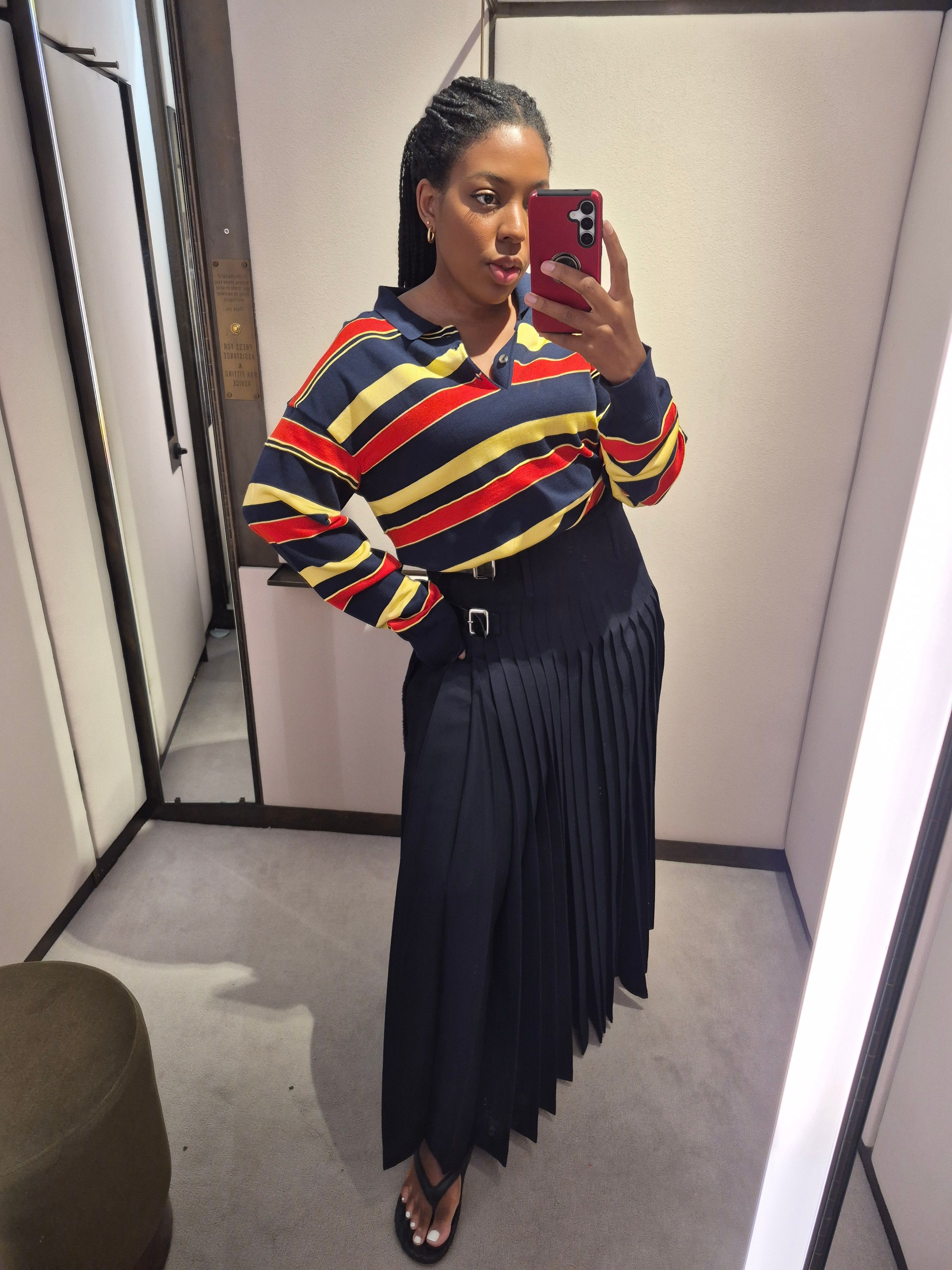 Remy Farrell wears JW Anderson rugby top and kilt for Selfridges luxury try on