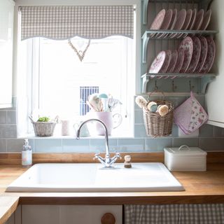 kitchen with wooden counter top and washbasin