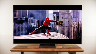 A TCL QM8L TV on a desk