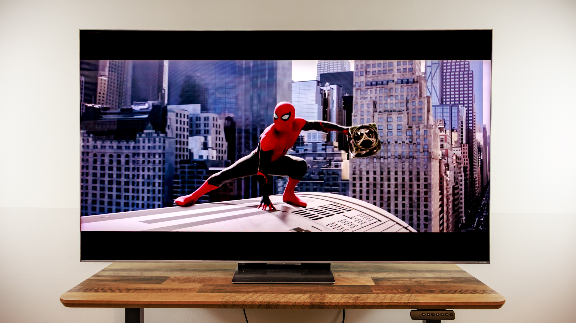 A TCL QM8L TV on a desk