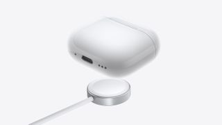 Apple AirPods 4 on a wireless charger