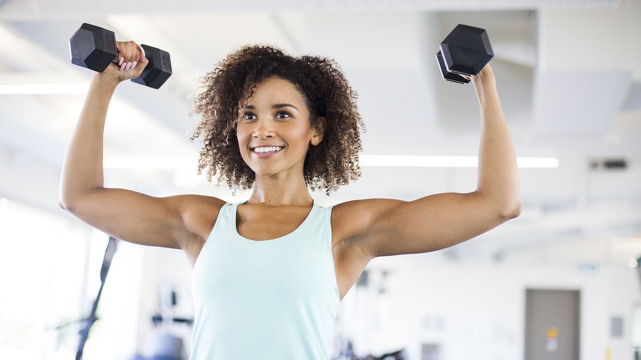 Young Woman Weightraining at the Gym