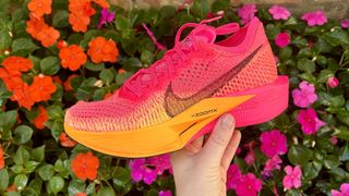 Nike Vaporfly Next% 3 side-on in front of flowers