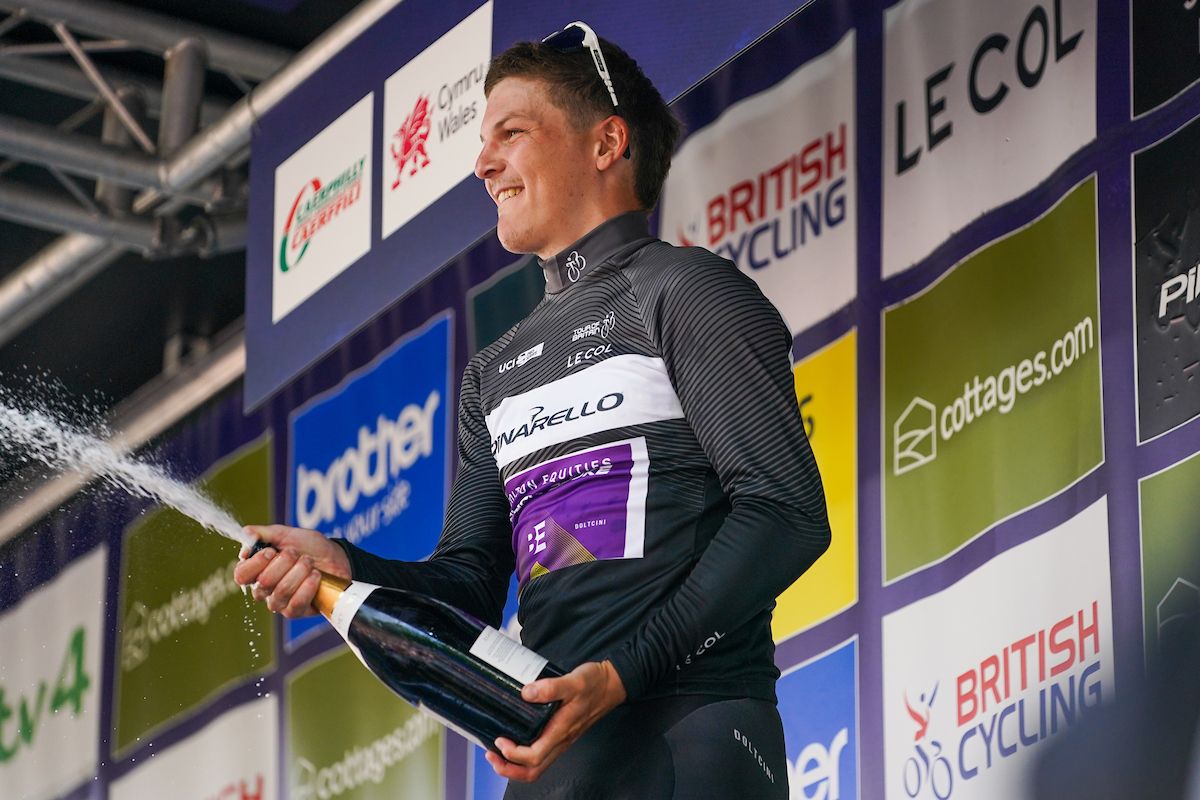Picture by Zac Williams/SWpix.com - 10/09/2023 - Cycling - 2023 Tour of Britain - Stage 8: Margam Country Park to Caerphilly (166.8km) - James Fouche of Team Bolton Equities Black Spoke (Wearing the Pinarello King of the Mountains Jersey) on the podium taking the victory in the Pinarello King of the Mountains classification