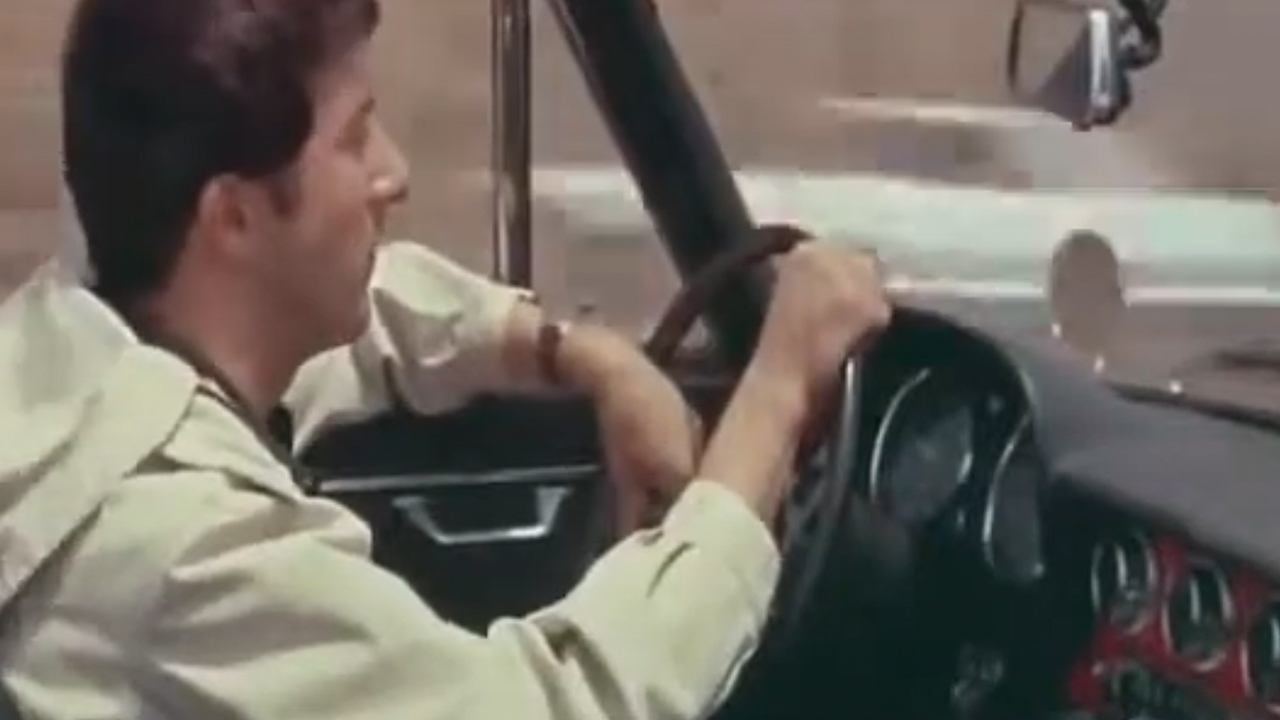 Dustin Hoffman driving a car in The Graduate.