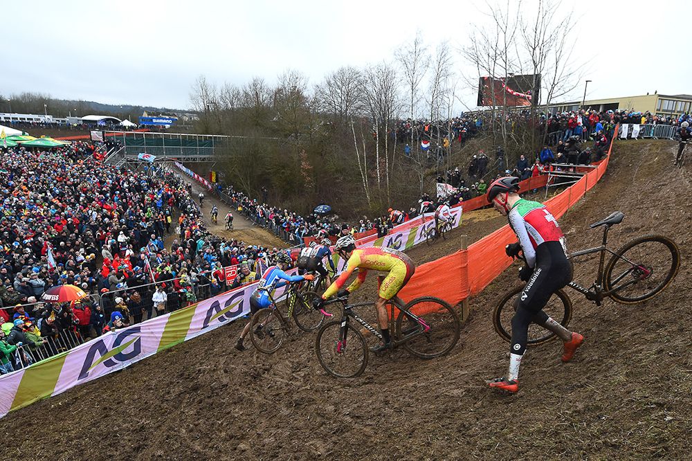Riders negotiate the slick downhill section