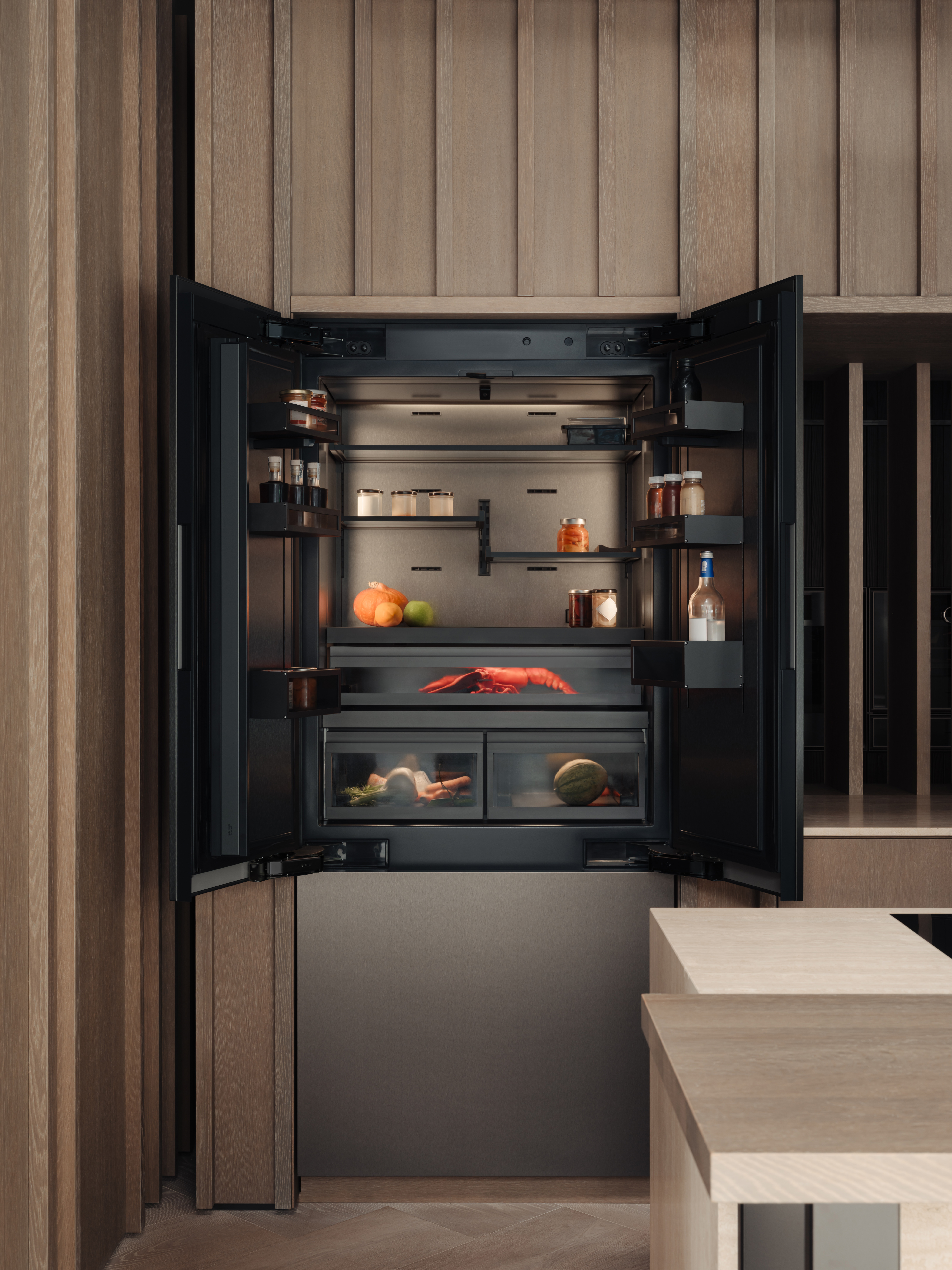 open fridge in a wood panelled kitchen