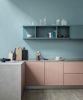 Pastel kitchen scheme featuring blue walls and pink units