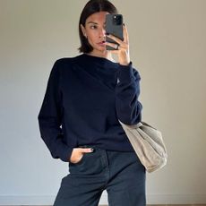 Woman in navy sweater