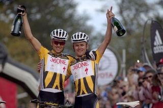 Christoph Sauser and Burry Stander of team 36One Songo-Specialized celebrate the overall win during the final stage