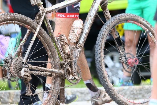 A racer's muddy bike after stage 2 of the Bike Four Peaks