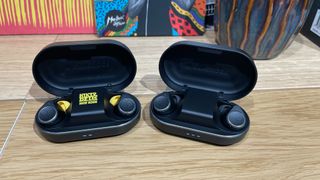 Cambridge Audio M100 How High Edition next to standard M100 earbuds