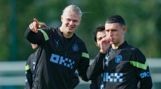 Manchester City's Erling Haaland and Phil Foden during a training session