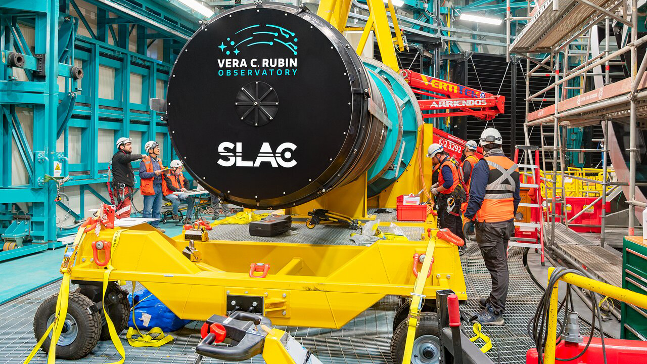 The Legacy Survey of Space and Time camera being installed by by a crew at the Vera C. Rubin Observatory