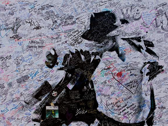 Fans have been signing a Michael Jackson memorial poster outside The Staples Centre.