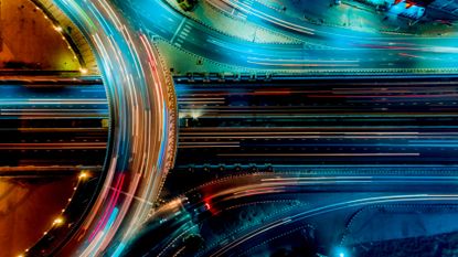 A colourfully-lit highway, which represents networking