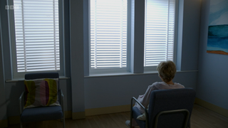 Jean Slater facing the window in hospital