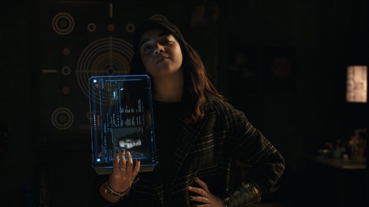 Kamala with a tablet recruiting Kate in The Marvels