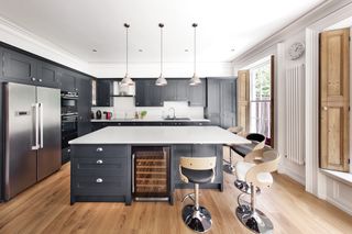 kitchen extension with dark units and white worktop