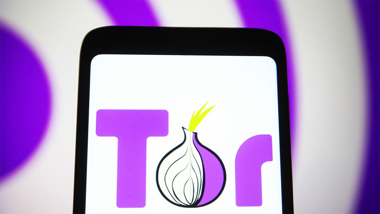 Tor Browser logo displayed on smartphone screen. The logo is purple and an onion makes up half the O letter