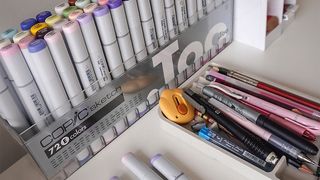 Artist studio; Karla Diaz, a mix of coloured pens on a desk