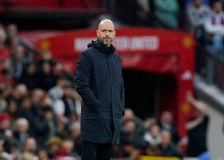 Manchester United manager Erik ten Hag, wearing a dark blue coat, looks on during the Premier League match against Newcastle United at Old Trafford on 14 May, 2024