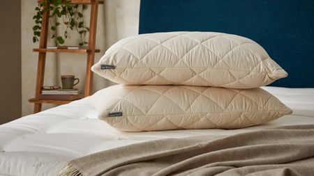 Woolroom Deluxe Washable Wool Pillows on a bed