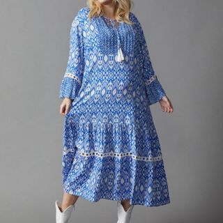 model wearing blue and white boho dress