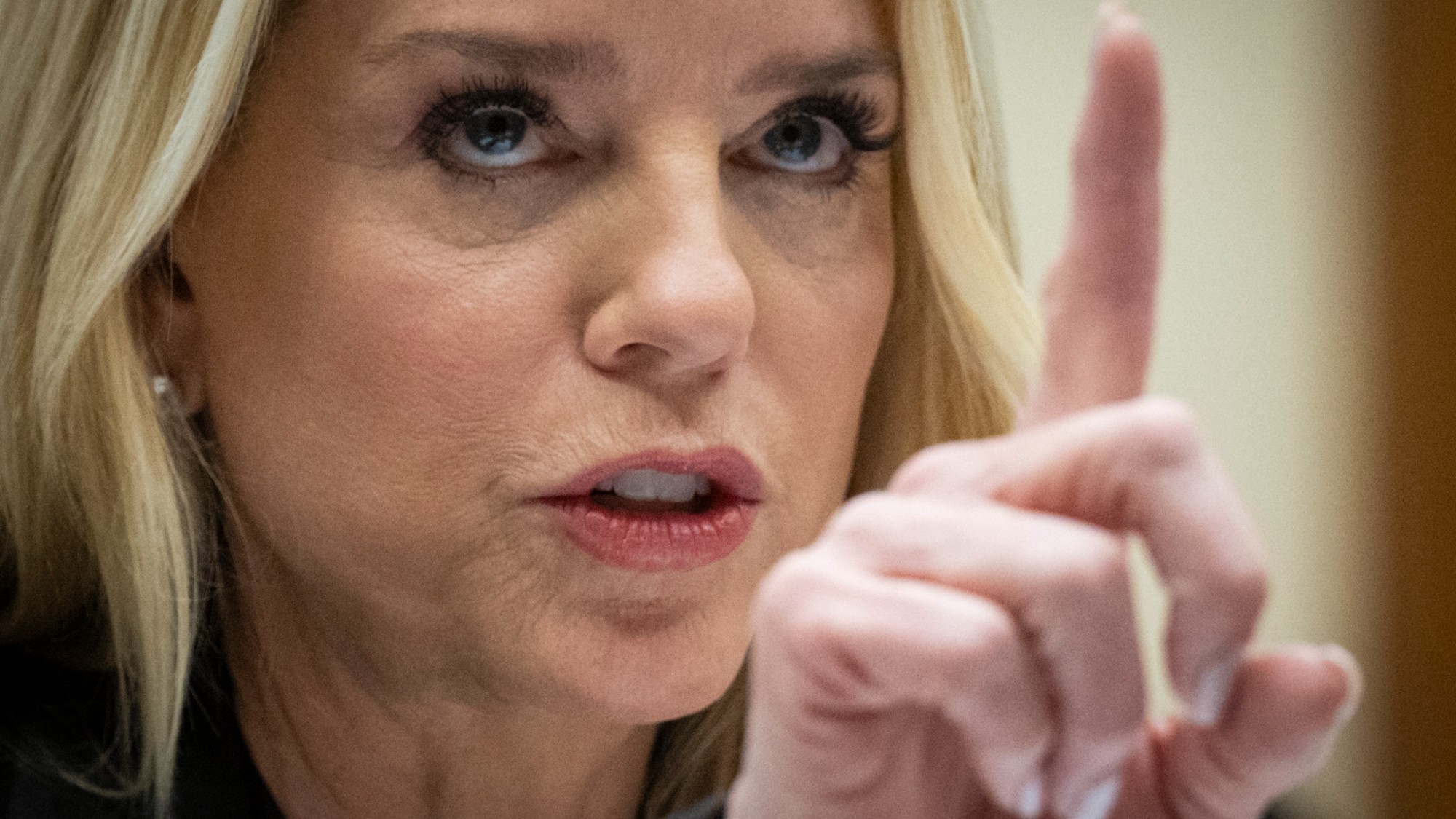 TOPSHOT - US Attorney General Pam Bondi testifies before a House Judiciary Committee hearing on "Oversight of the Department of Justice" on Capitol Hill in Washington, DC, on February 11, 2026. Congressional Democrats accused US Attorney General Pam Bondi of engaging in a "cover-up" of the Jeffrey Epstein files and turning the Justice Department into a weapon of retribution for President Donald Trump. Bondi, testifying before the House Judiciary Committee, defended the department's handling of the records about the convicted sex offender at a fiery hearing attended by a number of Epstein's victims. (Photo by ROBERTO SCHMIDT / AFP via Getty Images)